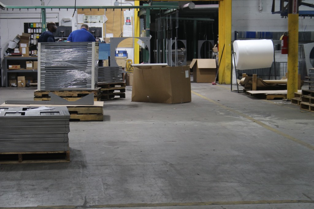 Fabricated sheet metal parts staged on the Metcam shop floor